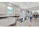 Bright kitchen featuring white cabinets, stainless steel appliances, and breakfast bar at 1410 Shadow Ct, Zionsville, IN 46077