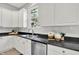 Elegant kitchen features white cabinetry, stylish decor, and stainless steel appliances at 1410 Shadow Ct, Zionsville, IN 46077