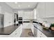 Spacious kitchen with white cabinets, island cooktop, and stainless steel oven at 1410 Shadow Ct, Zionsville, IN 46077