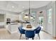 Open kitchen and breakfast nook featuring white cabinets, stainless appliances, and lots of light at 1410 Shadow Ct, Zionsville, IN 46077