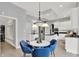Bright kitchen with stainless appliances adjoins the breakfast nook with hardwood floors at 1410 Shadow Ct, Zionsville, IN 46077