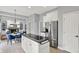 Spacious kitchen with stainless steel appliances flows into the dining area at 1410 Shadow Ct, Zionsville, IN 46077