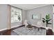 Cozy living room featuring dark hardwood floors, and a comfortable seating area at 1410 Shadow Ct, Zionsville, IN 46077