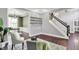 Inviting living room showcasing hardwood floors, staircase, and accent wall design at 1410 Shadow Ct, Zionsville, IN 46077