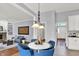 Open floor plan with breakfast nook, fireplace, hardwood floors, and neutral decor at 1410 Shadow Ct, Zionsville, IN 46077