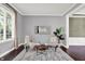 Cozy living room featuring dark hardwood floors, and a comfortable seating area at 1410 Shadow Ct, Zionsville, IN 46077