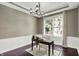 Well-lit office with a wooden desk, and view into the living space at 1410 Shadow Ct, Zionsville, IN 46077