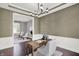 Charming home office with wooden desk, wainscoting, and ample natural light at 1410 Shadow Ct, Zionsville, IN 46077