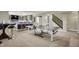 A finished basement with a ping pong table and kitchenette at 15023 Glenmoor Cir, Carmel, IN 46033