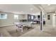 An open basement features ping pong, kitchenette, and entertainment space at 15023 Glenmoor Cir, Carmel, IN 46033