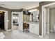 Bathroom boasts tile floors, a large vanity, an open doorway to a walk-in closet, and a view of the bedroom at 15023 Glenmoor Cir, Carmel, IN 46033