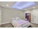 Cozy bedroom with a cushioned bed, recessed ceiling lighting, and display shelving at 15023 Glenmoor Cir, Carmel, IN 46033