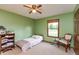 Charming bedroom with green walls, window view, and a cozy single bed at 1607 Michelle Manor, Danville, IN 46122