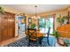 Open dining room with view to backyard and adjacent laundry area at 1607 Michelle Manor, Danville, IN 46122