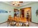 Elegant dining room featuring a wood table set, floral wallpaper and bright, natural light at 1607 Michelle Manor, Danville, IN 46122