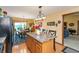Bright kitchen with an island, oak cabinets, and view to the dining room at 1607 Michelle Manor, Danville, IN 46122