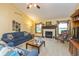 Comfortable living room featuring a fireplace, plush seating and bright natural light at 1607 Michelle Manor, Danville, IN 46122