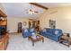 Bright living room with high ceilings, ceiling fan and comfortable seating offers a cozy atmosphere at 1607 Michelle Manor, Danville, IN 46122