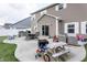 A backyard patio with ample seating and outdoor amenities at 1661 Devonshire Ave, Avon, IN 46123