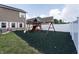 Backyard play area with play set and green rubber mulch for safety at 1661 Devonshire Ave, Avon, IN 46123