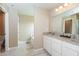 A pristine bathroom features dual sinks and a view of a soaking tub at 1661 Devonshire Ave, Avon, IN 46123
