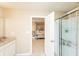 An ensuite bathroom connects to a spacious main bedroom with a four-post bed at 1661 Devonshire Ave, Avon, IN 46123