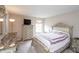 A cozy bedroom features neutral decor, a dresser, and a comfortable bed at 1661 Devonshire Ave, Avon, IN 46123