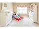 This bedroom features light beige paint, white furnishings, and light carpet at 1661 Devonshire Ave, Avon, IN 46123