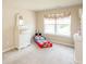 This bedroom features light beige paint, white furnishings, and light carpet at 1661 Devonshire Ave, Avon, IN 46123