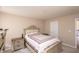 Cozy bedroom featuring an ornate headboard, two nightstands and neutral walls at 1661 Devonshire Ave, Avon, IN 46123