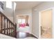 View of the foyer, playroom, and powder room from the staircase, showcasing open layout at 1661 Devonshire Ave, Avon, IN 46123