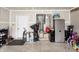 Interior view of the garage featuring an abundance of storage opportunities and a white door at 1661 Devonshire Ave, Avon, IN 46123