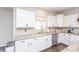 Well-lit kitchen featuring granite counters, stainless steel appliances, and white cabinetry at 1661 Devonshire Ave, Avon, IN 46123