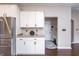 Bright kitchen with white cabinets, stainless steel appliances and granite countertops at 1661 Devonshire Ave, Avon, IN 46123