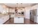 Elegant kitchen with stainless steel appliances, granite countertops, and a center island at 1661 Devonshire Ave, Avon, IN 46123