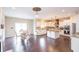 Spacious kitchen with granite countertops, chandeliers and stainless steel appliances at 1661 Devonshire Ave, Avon, IN 46123