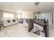 Cozy upstairs loft featuring a couch, neutral carpet, railing, and chandelier at 1661 Devonshire Ave, Avon, IN 46123