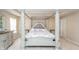 A luxurious main bedroom features a four-post bed and a beautiful dresser at 1661 Devonshire Ave, Avon, IN 46123