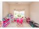 Playroom featuring neutral walls, a window with curtains, and an array of colorful toys at 1661 Devonshire Ave, Avon, IN 46123