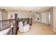 Open upstairs landing with railings overlooking other rooms, features neutral carpet and paint at 1661 Devonshire Ave, Avon, IN 46123