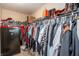 A fully organized walk-in closet features ample hanging space and a Cannon safe at 1661 Devonshire Ave, Avon, IN 46123