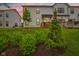 Home at dusk, featuring lush lawn, backyard landscaping, and a wooden deck for outdoor entertaining at 17551 Gruner Way, Westfield, IN 46062
