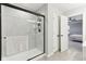 Bathroom showcasing a sleek glass shower and an open doorway to the primary bedroom at 17551 Gruner Way, Westfield, IN 46062