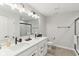 Elegant bathroom featuring double sinks, modern fixtures, and a glass-enclosed shower at 17551 Gruner Way, Westfield, IN 46062