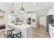 Modern kitchen with white cabinets, stainless steel appliances, and kitchen island with barstool seating at 17551 Gruner Way, Westfield, IN 46062