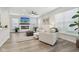 Cozy living room with fireplace, TV, ceiling fan, and comfortable seating at 17551 Gruner Way, Westfield, IN 46062