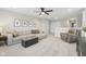 Spacious living room with neutral decor, a sectional sofa, and a ceiling fan at 17551 Gruner Way, Westfield, IN 46062