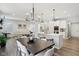 Open living spaces, kitchen, and dining room with hardwood floors and neutral paint throughout at 17551 Gruner Way, Westfield, IN 46062