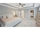 Light-filled primary bedroom with a tray ceiling, ensuite bathroom, and walk-in closet at 17551 Gruner Way, Westfield, IN 46062