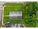 Aerial view of a home with a big backyard, surrounded by mature trees at 1802 Sugar Grove Ave, Indianapolis, IN 46202